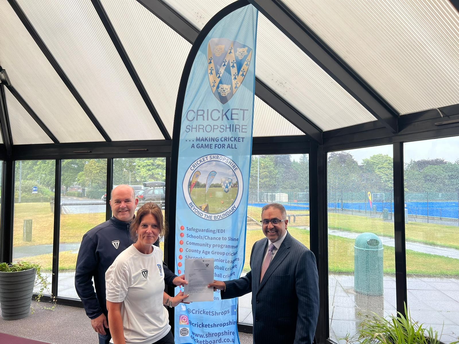 Interfaith Council representatives with Cricket Shropshire beside a Cricket Shropshire banner